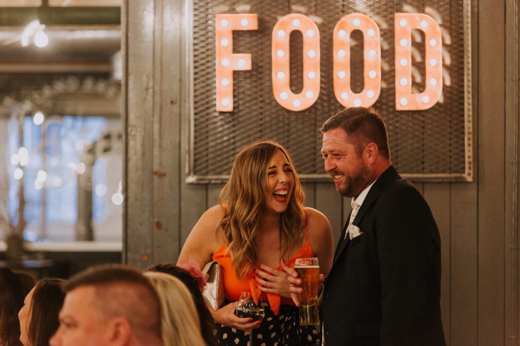 laughing wedding guest