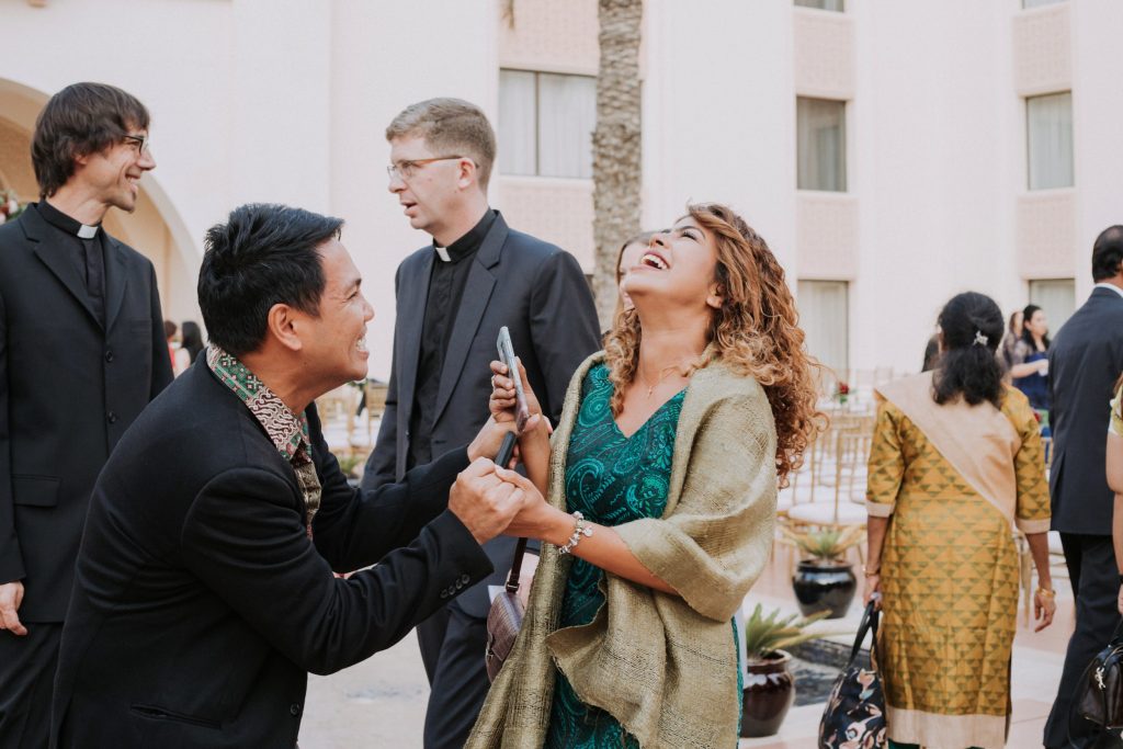 wedding guest laughing