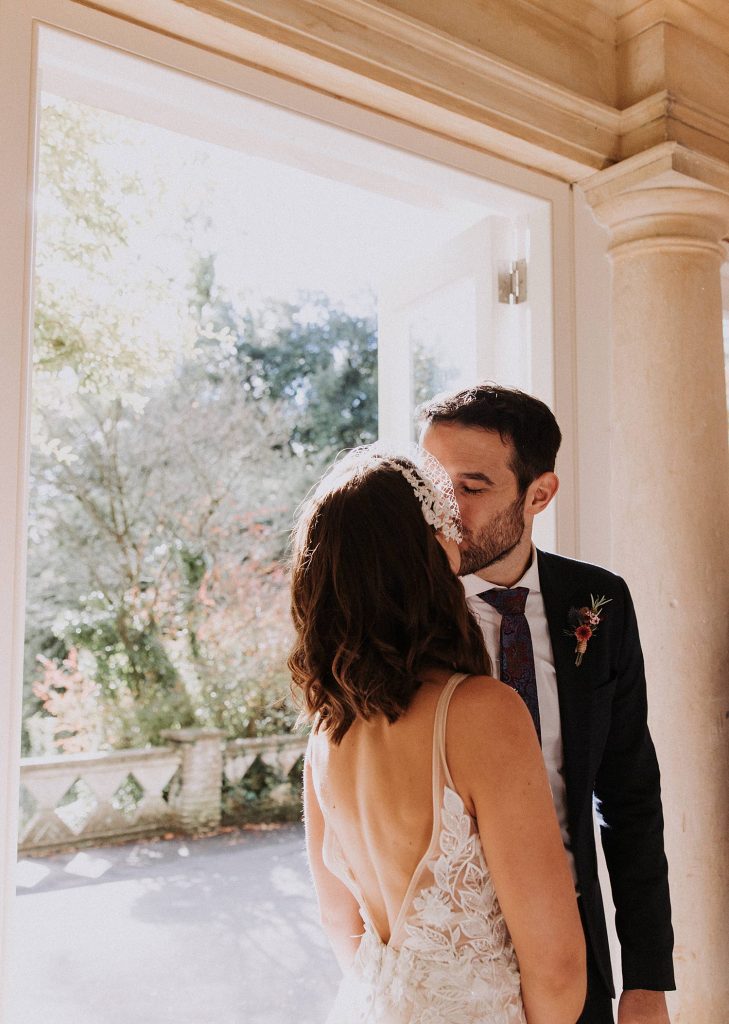 bride and groom kiss