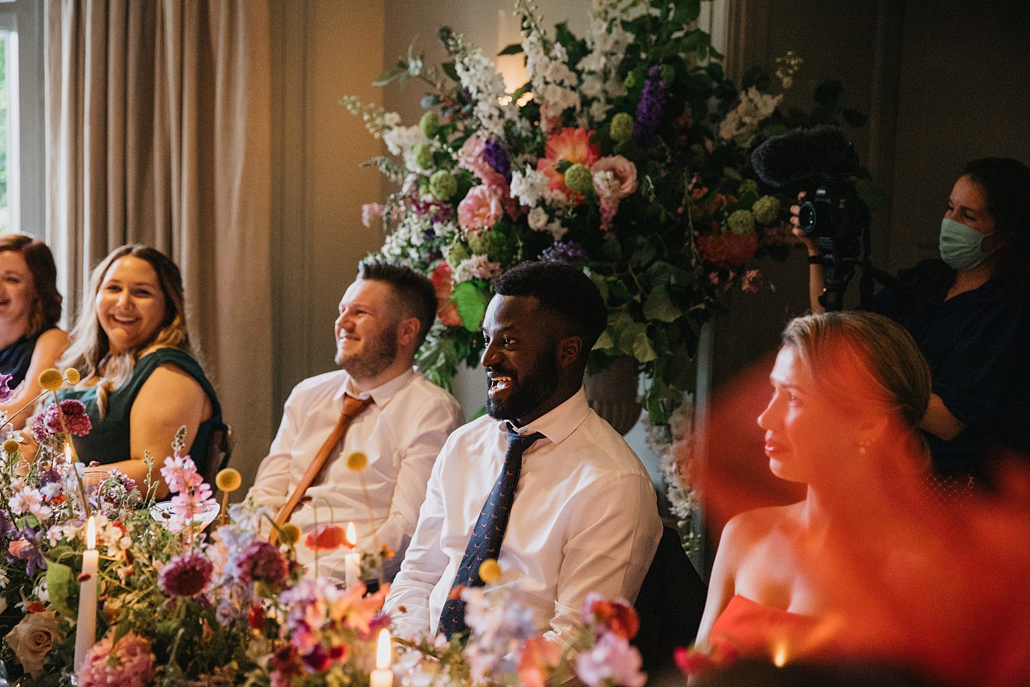 wedding guests laughing